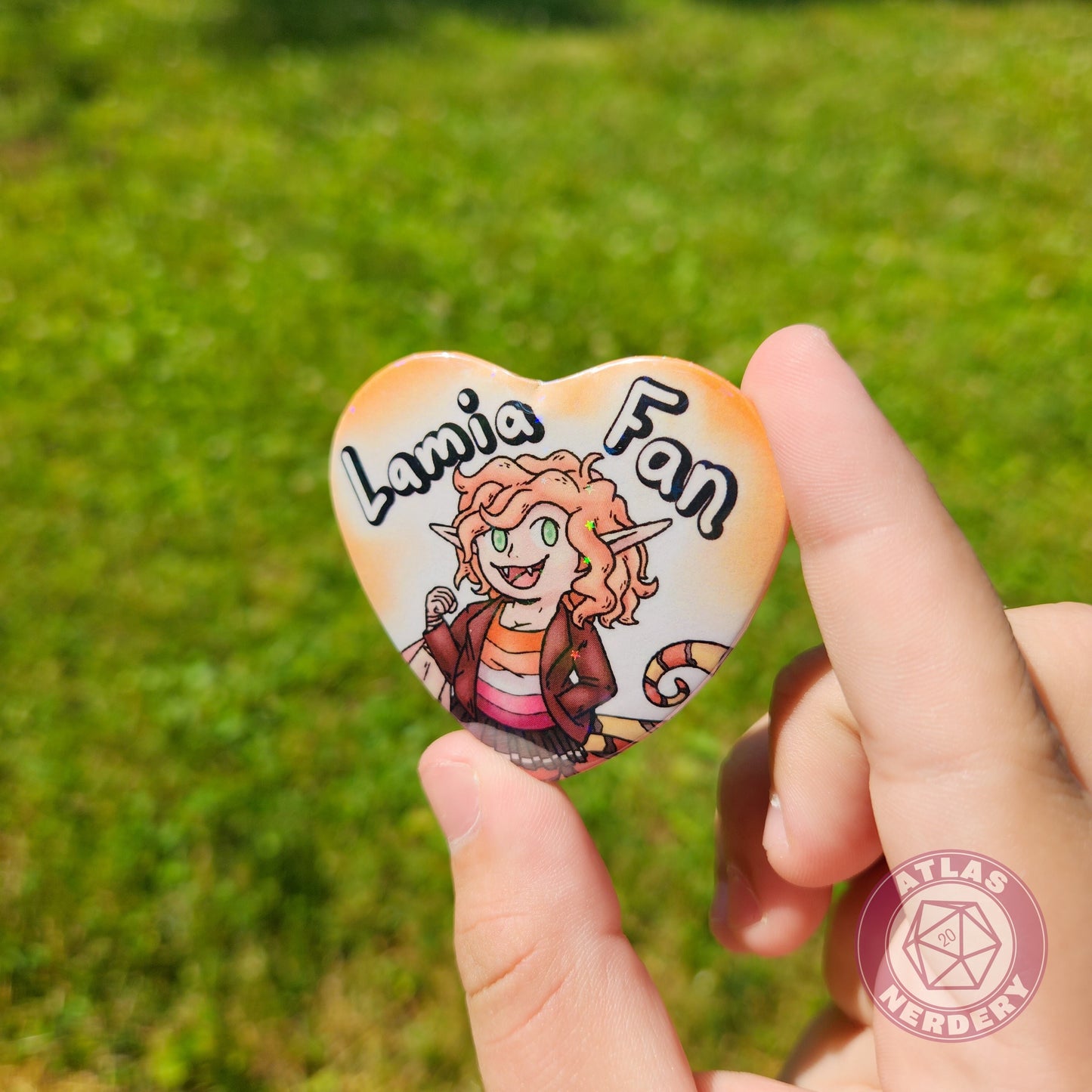 Lamia Fan - 2.25” x 2” Holographic Heart Shaped Pinback Button