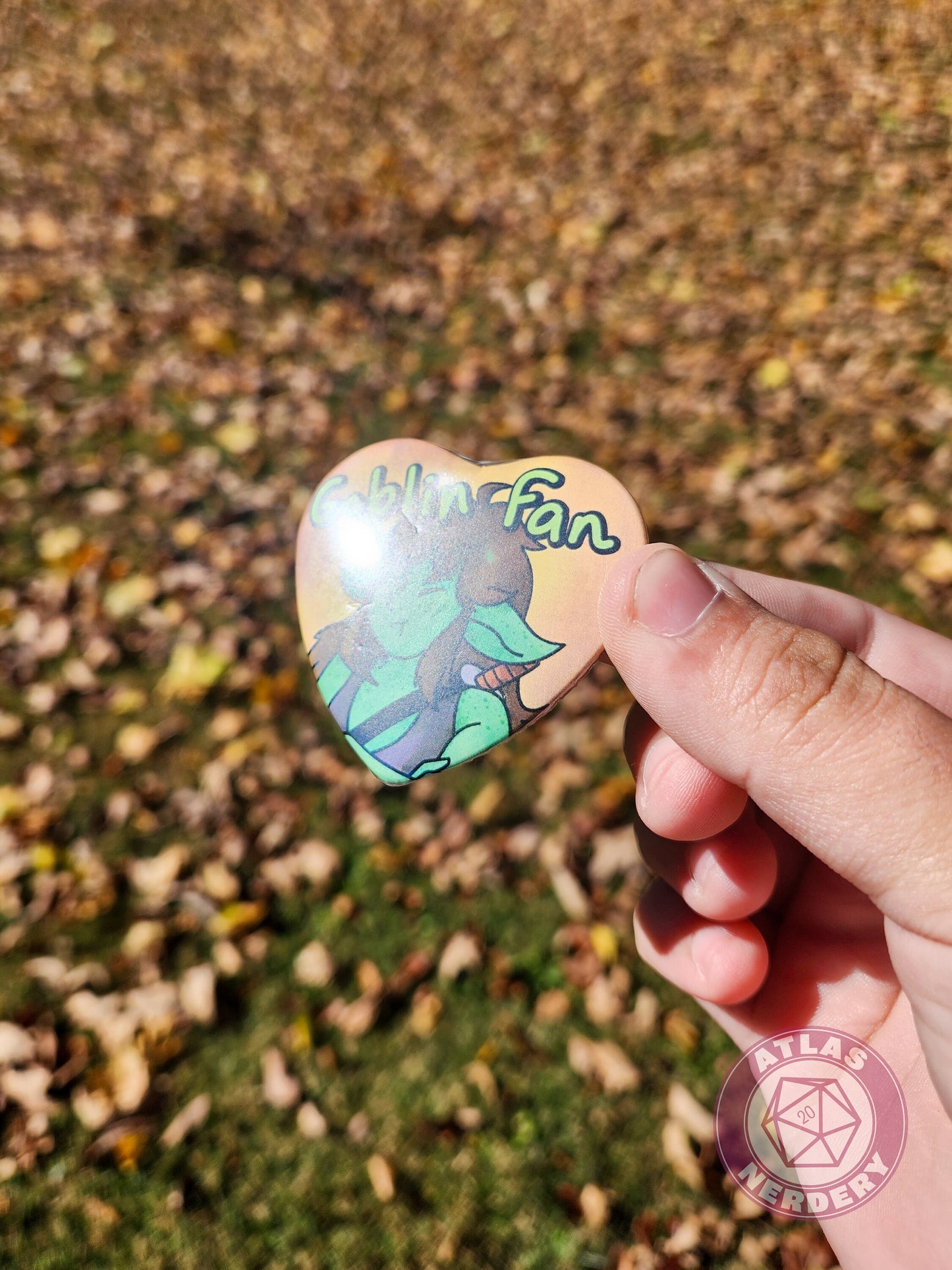 Goblin Fan - 2.25” x 2” Holographic Heart Shaped Pinback Button