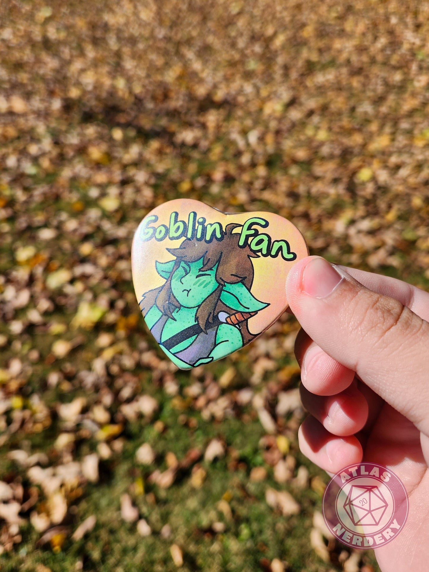 Goblin Fan - 2.25” x 2” Holographic Heart Shaped Pinback Button